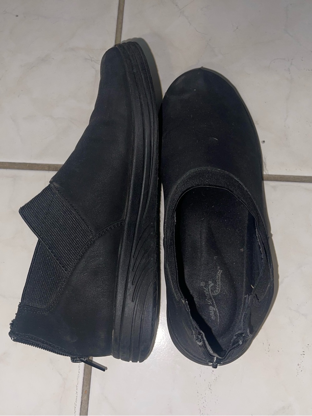 Woman’s Black Slip-On boots with zipper